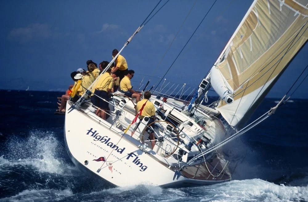 The first Swan 60, then named Highland Fling, heeled upwind with her crew on the rail